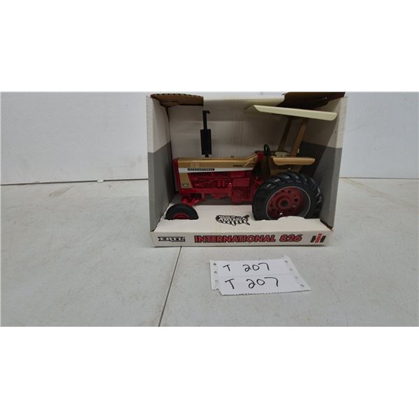 Ertl International 826 Die-Cast Toy Tractor, 1/16 Scale, Red and Gold with Tan Canopy