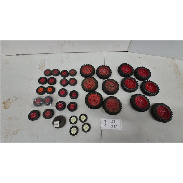 35 Assorted Toy Tractor Wheels with Black Rubber Tires and Red Plastic Hubs