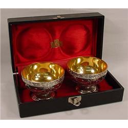 PAIR OF SILVER AND GOLD COLORED SHERBETS IN CASE -