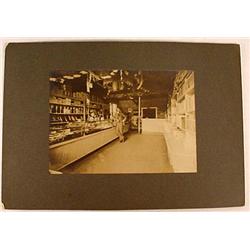 ANTIQUE MOUNTED PHOTO OF A CIGAR STORE INTERIOR - 