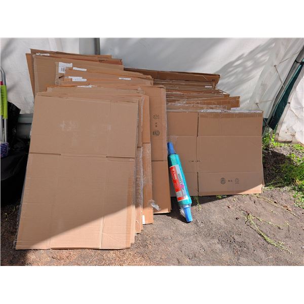Flattened Cardboard Moving Boxes and Movers Wrap