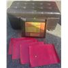 Image 1 : Tufted Faux Leather Storage Ottoman, Framed Print, and Red Placemats