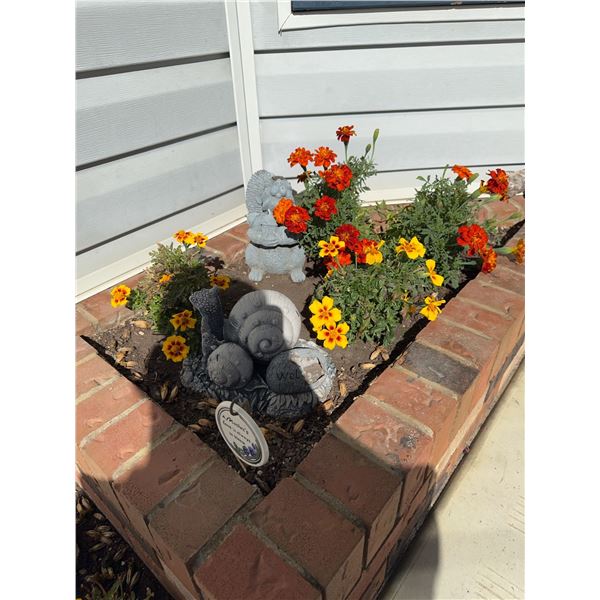 Marigold Flower Bed With Concrete Snail and Squirrel Statues
