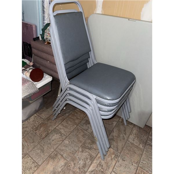 Four Stacking Metal Frame Grey Vinyl Upholstered Chairs