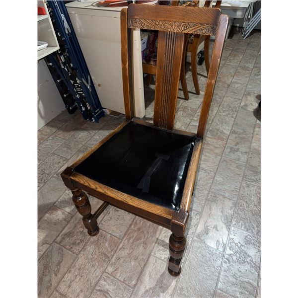 4 wooden dining chairs featuring carved detailing on the backrests and turned front legs. Each chair