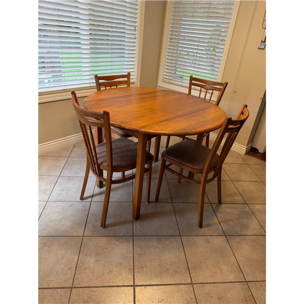 Table And Chairs Table has Drop Side 41 inches round when sides are dropped. It's 22 1/2 inches wide