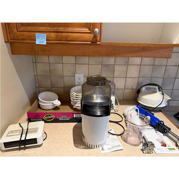 Small kitchen appliances and white bowls