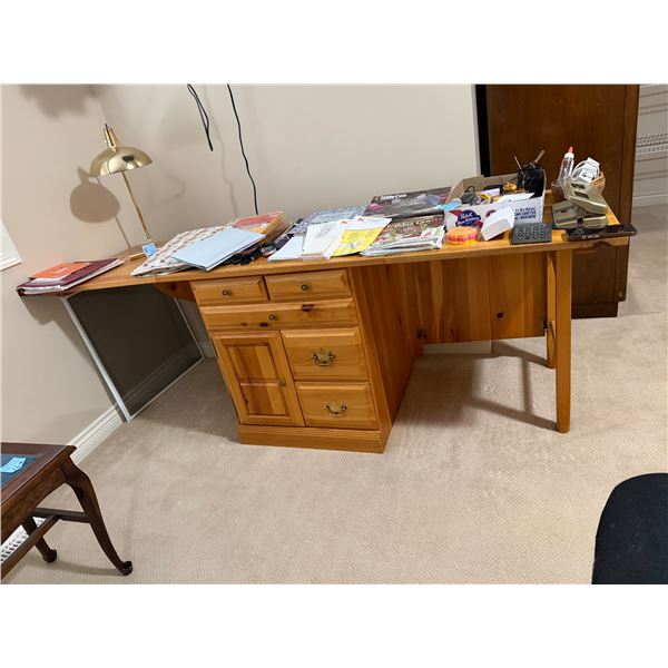 Drop side sewing table approximately 81 inches with sides up and approximately 33 1/2 inches with si