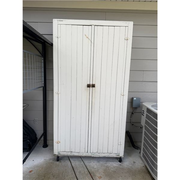 Rolling garden cabinet contents not included 46" x 18" x 88" tall