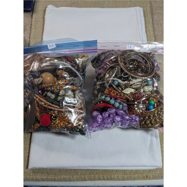 2 LARGE BAGS OF MISC JEWELRY, BEADS, PARTS ETC