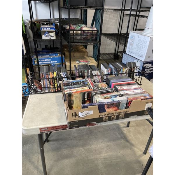 DVD RACK WITH ASSORTED DVDS AND ELVIS CD SET, AND TRAY OF DVDS