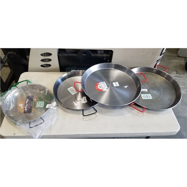 4 PAELLA PANS. TWO ARE 18 INCH, ONE IS 16 INCH AND ONE IS A 13.5 INCH PAN