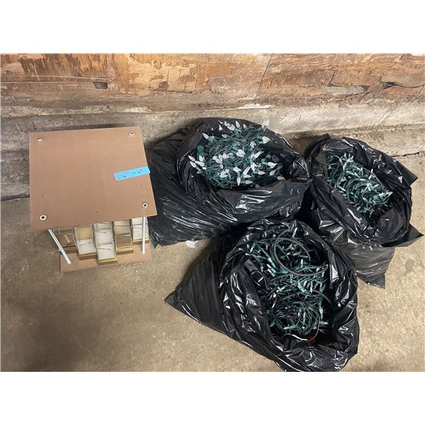L2 - Group Lot of Three Bags of Holiday String Lights and Custom Gold/Clear Display Stand