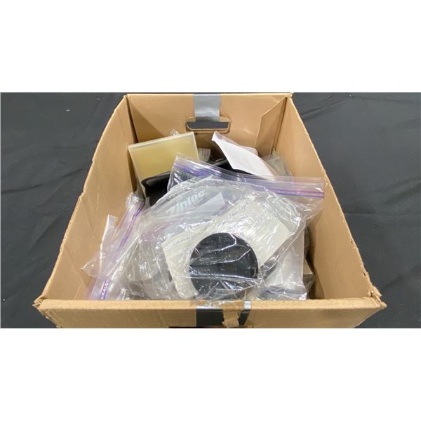 BOX OF ASSORTED FILTERS, WINDERS, LENS CAPS, BODY CAPS, EL FUSES, QUICK FOCUSING HANDLES & STRAPS