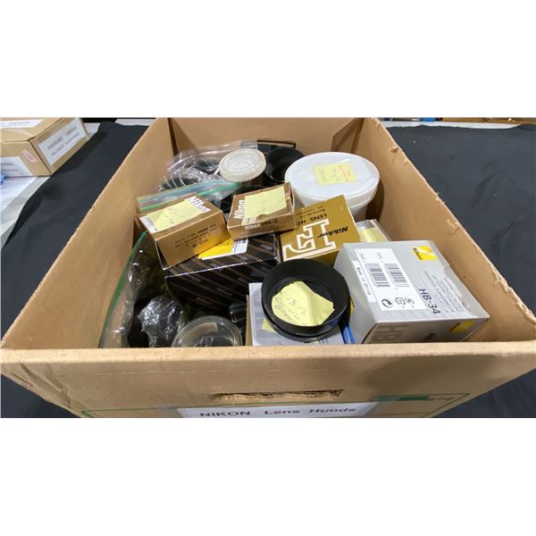BOX OF ASSORTED NIKON LENS HOODS & PLASTIC LENS CASES