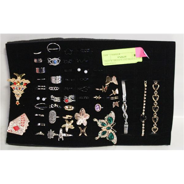 TRAY W/ BROOCH AND BRACELETS AND RINGS