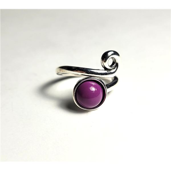 8)  BEZEL SET PINK STONE SET IN A SILVER