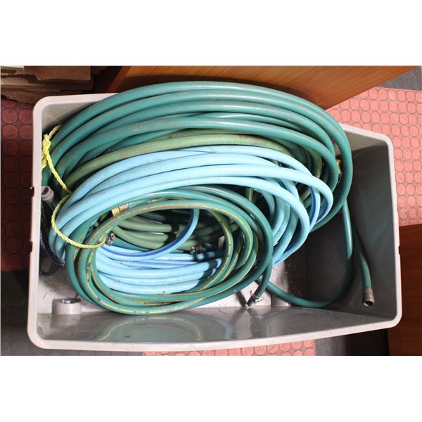 TOTE FULL OF GARDEN HOSES