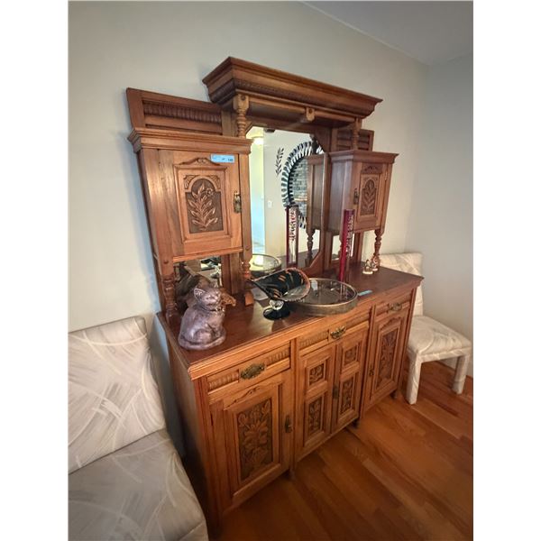 Victorian carved oak mirror-backed sideboard buffet with raised foliate panel carvings and a central