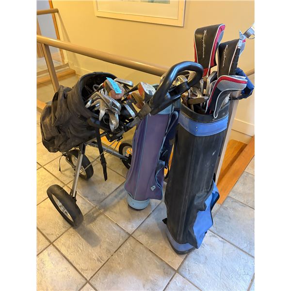 Group of Golf Gear - Includes golf bags, clubs, and a two-wheel pull cart