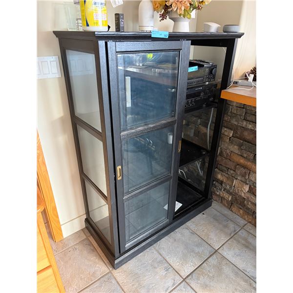Glass- door cabinet in a black-stained finish