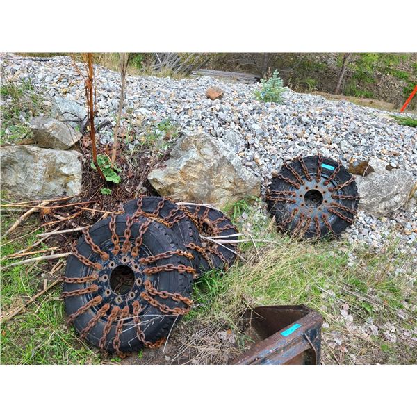 Group of 4 Chained Tires