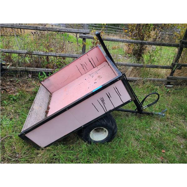 Pink tow-behind garden dump trailer