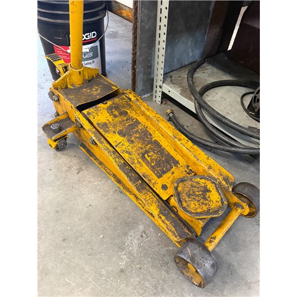 Yellow hydraulic floor jack