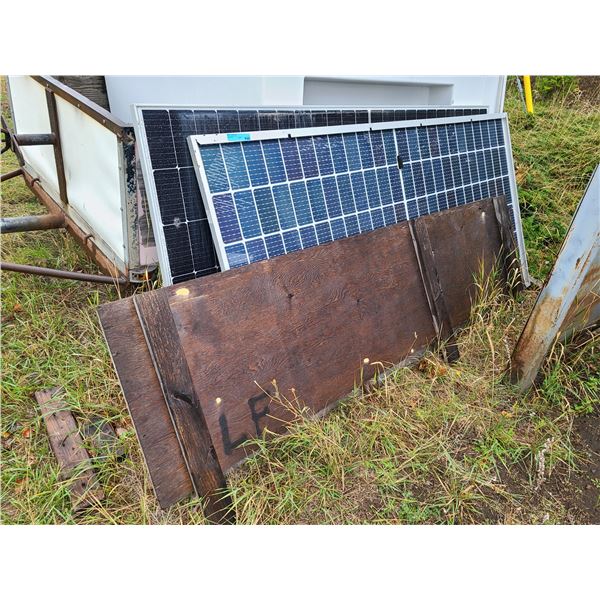 Group of Solar Panels and a sheet of wood
