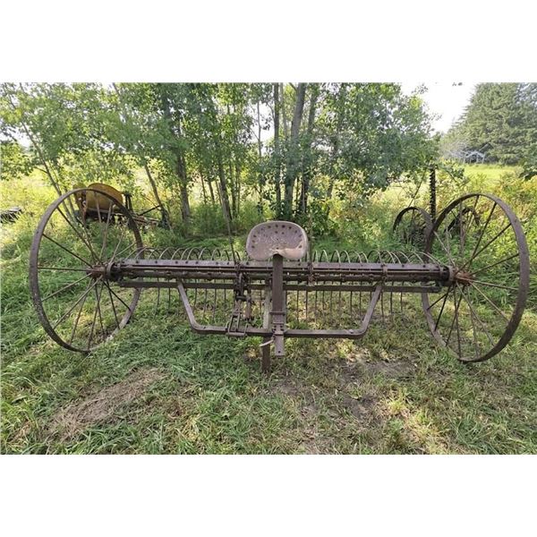 Antique Metal Horse-Drawn Farm Implement with Iron Wheels