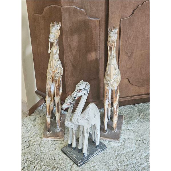 Three Carved Wooden Animal Figures on Bases