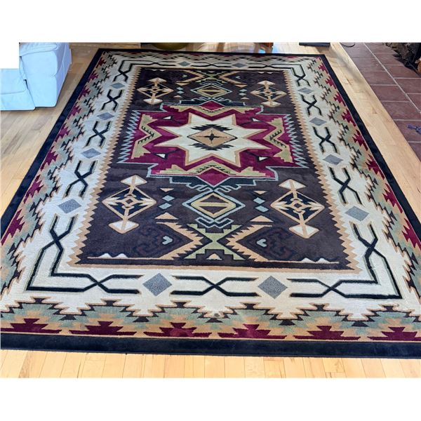 SOUTHWESTERN-STYLE AREA RUG FEATURING A GEOMETRIC TRIBAL PATTERN; 7-FT 10-IN X 10-FT 6-IN