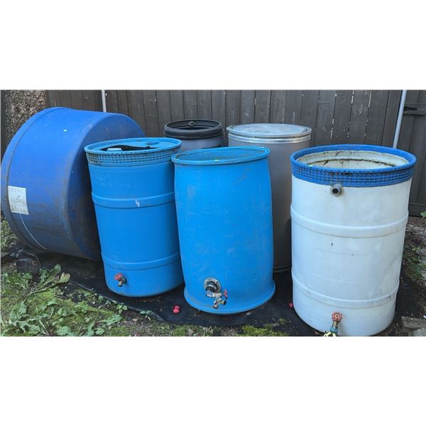 Six Outdoor Plastic and Metal Barrels with Valves and Lids