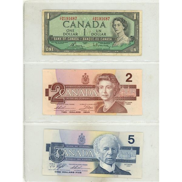 1954 Canada One Dollar and 1986 Canada Uncirculated Two and Five Dollars.