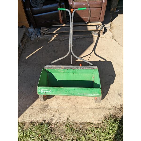 Grass seed/fertilizer spreader