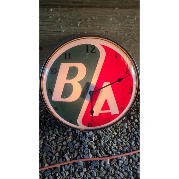B/A British American Clock – Working.  Made from a globe lens & display light.  Electric ba