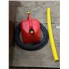 Image 4 : plastic tube, gas can, bike tires