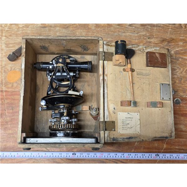 Vintage surveyors theodolite with wooden case and leather handle and tripod