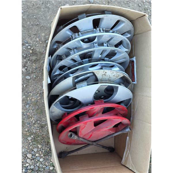 Lot of hubcaps and tire iron
