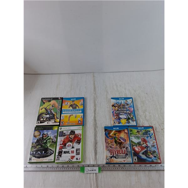 (3) WiiU Games, Zelda, Mario, Super Smash Bros, (4) Empty Game Cases No Disc