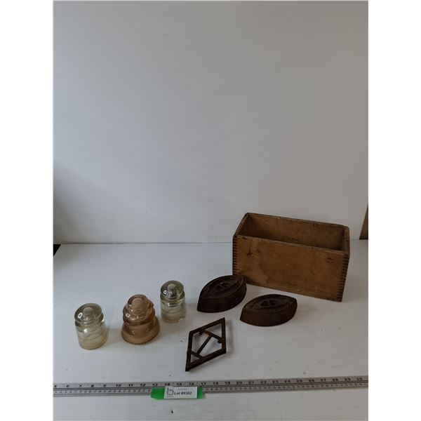 (3) Vintage Glass Electrical Insulators, (2) Metal Irons, (1) Iron Stand, (1) Wooden Box