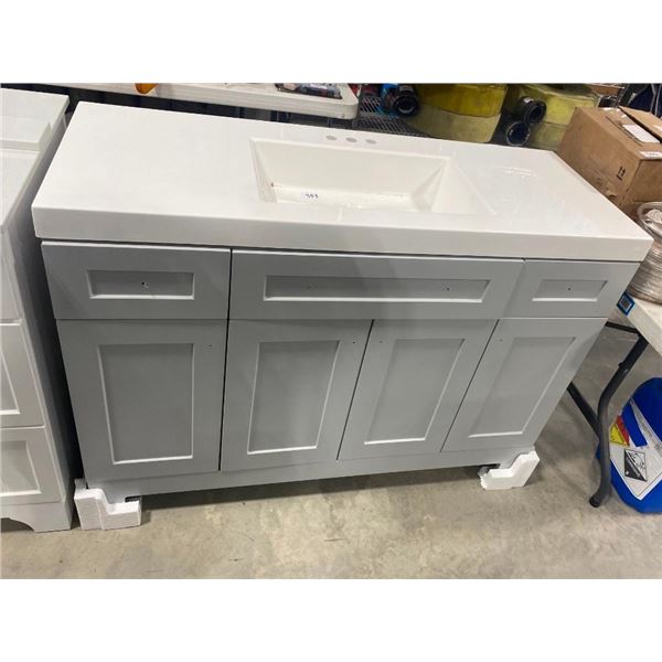 48IN BATHROOM VANITY - BOTTOM RIGHT SIDE HAS TINE HOLE AS SEEN IN PIC