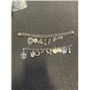 Image 1 : 2 SILVER TONED BRACELETS & CHARMS