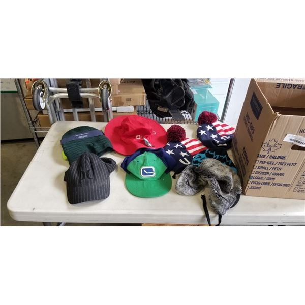 TRAY OF HATS/TOQUES INCLUDING CANUCKS HAT, AMERICAN EAGLE TOQUE, GERTEX CANADA HAT ETC
