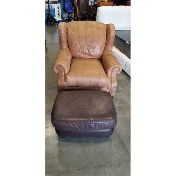 BROWN LEATHER WINGBACK ARMCHAIR AND A BROWN LEATHER OTTOMAN WITH A PILLOW TOP CUSHION
