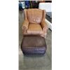 Image 1 : BROWN LEATHER WINGBACK ARMCHAIR AND A BROWN LEATHER OTTOMAN WITH A PILLOW TOP CUSHION