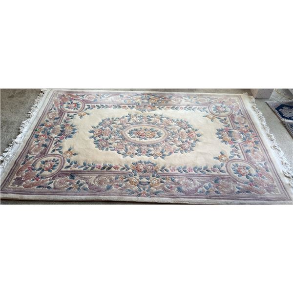 Rectangular Wool Area Rug with Floral Medallion and Fringe
