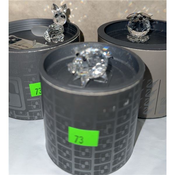 3 Crystal Animal Figurines with Black Accents on Cylindrical Boxes