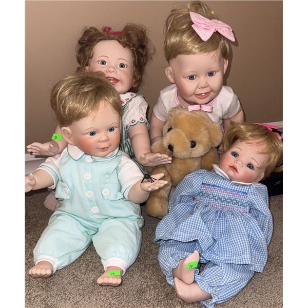 Four Porcelain Baby Dolls with Assorted Outfits and Teddy Bear