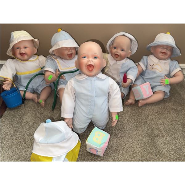 Five Porcelain Baby Dolls in Blue and White Outfits with Accessories